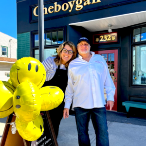 Photo of Jane and Jeff in front of Cheboygan Coffee Roasters